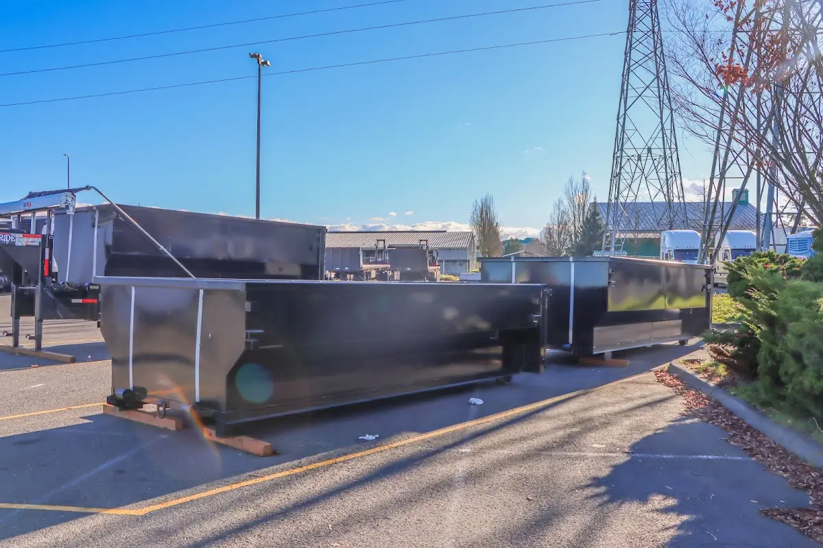 Roll-off dumpster ready for waste disposal at job site for 2 Yard Dumpster Rental in Genoa